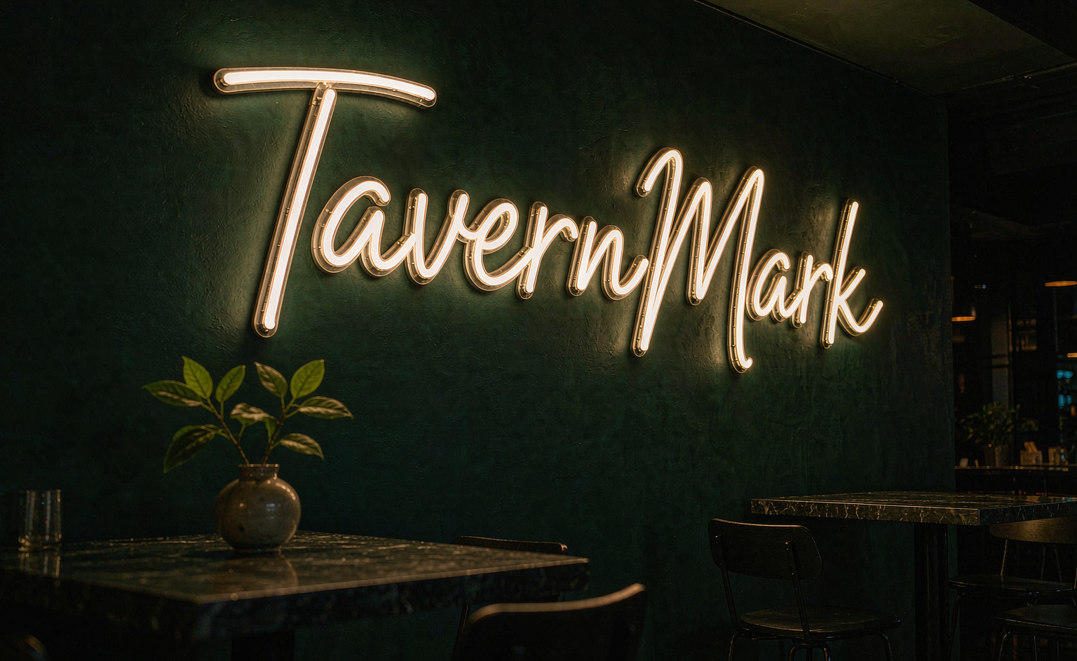 Custom neon sign in a dark green restaurant interior